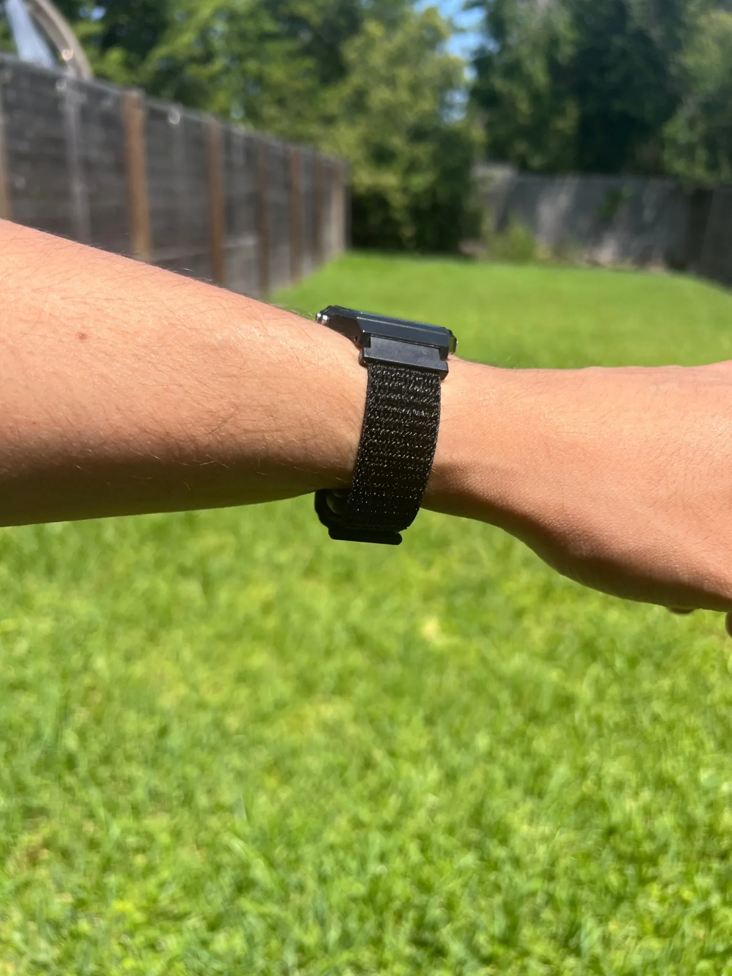 Side view of the PIV F-91 worn on the wrist outdoors